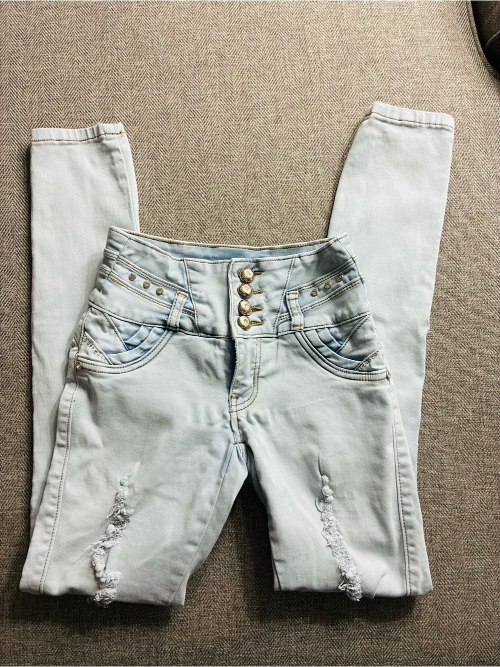 High-Rise Light Blue Skinny Jeans with Button Front